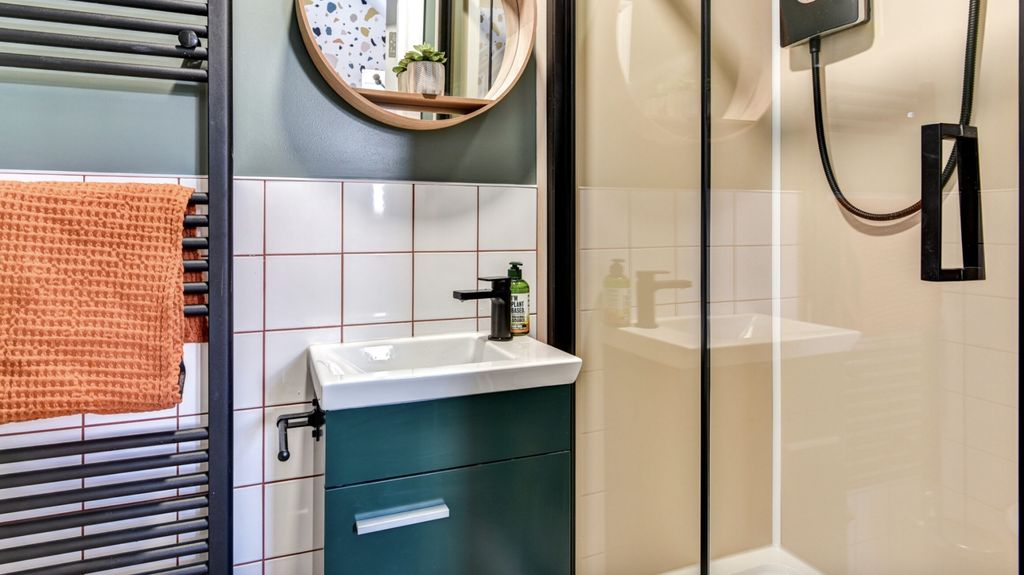 Property photo 1 of 5 This Stylish Bathroom Features A Sleek Shower And ...