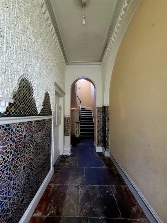Property photo 1 of 10 A Charming Hallway Featuring Decorative Tiled Wall...