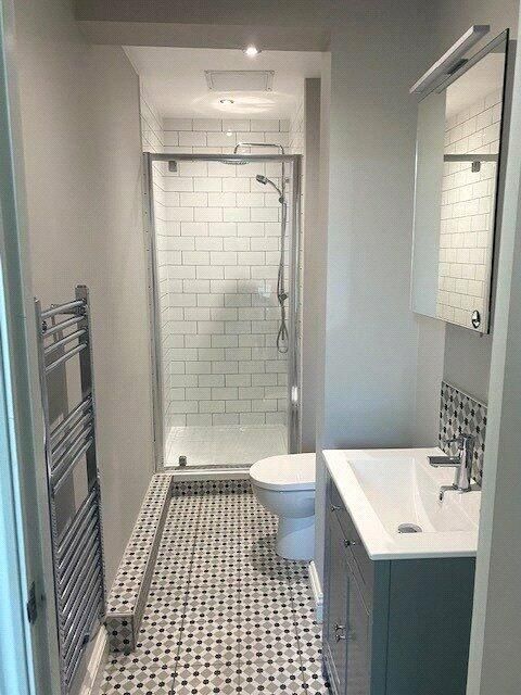 Property photo 2 of 5 A Modern Bathroom Featuring A Walk-In Shower With ...