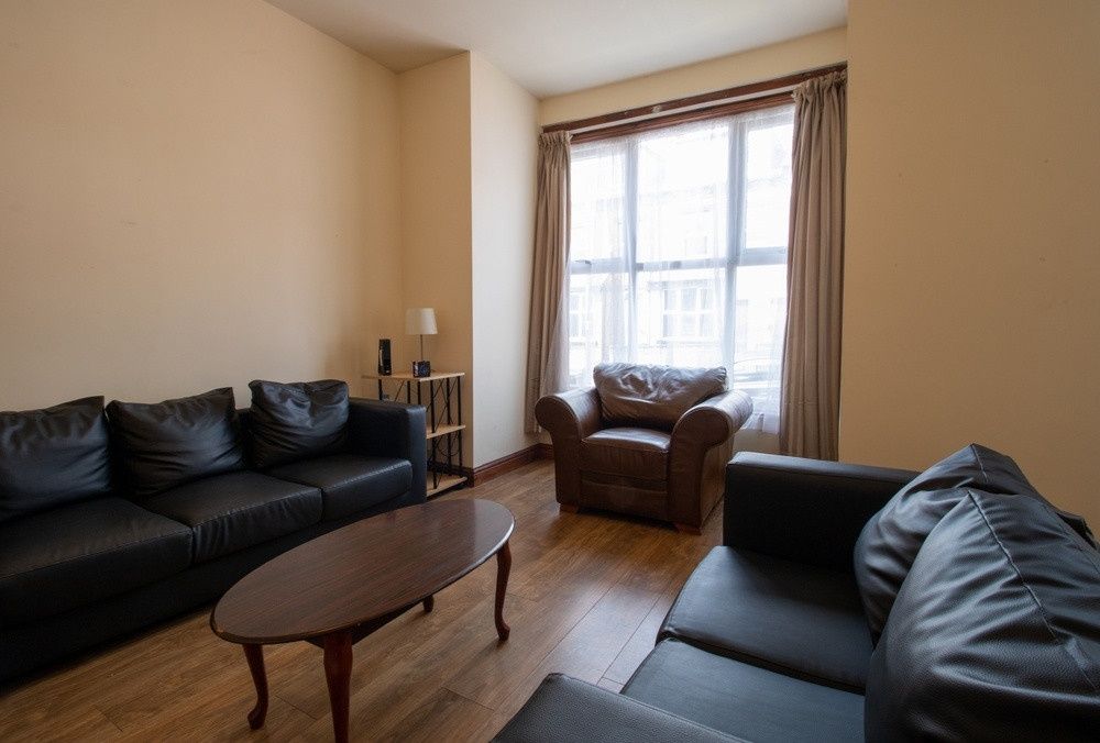 Property photo 1 of 13 A Spacious And Cozy Living Room With Comfortable S...