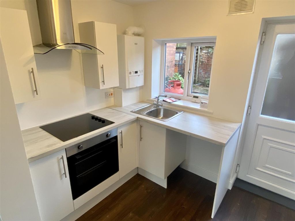 Property photo 2 of 5 Bright Modern Kitchen With Sleek Integrated Oven...