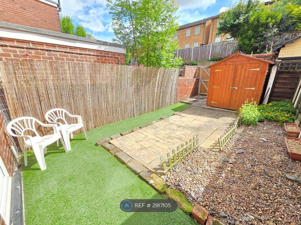 Property photo 2 of 10 Gravel And Faux Grass Garden