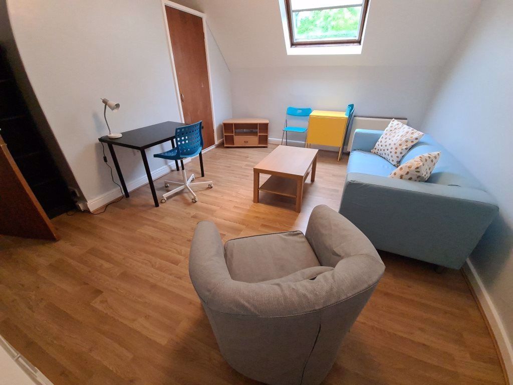 Property photo 3 of 7 A Bright And Welcoming Living Room Featuring A Com...