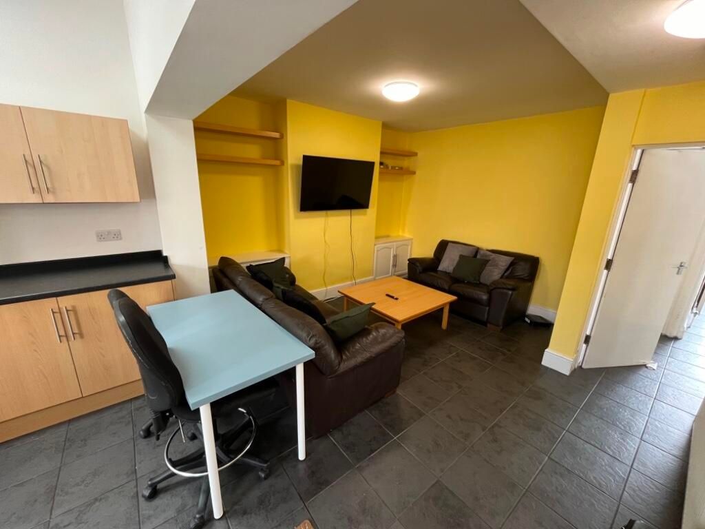 Property photo 3 of 7 Bright, Modern Living Area With Bold Yellow Featur...