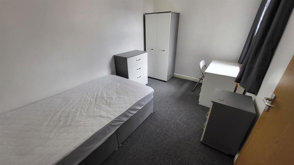 Property photo 3 of 14 A Neat And Simple Single Bedroom Featuring A Bed, ...