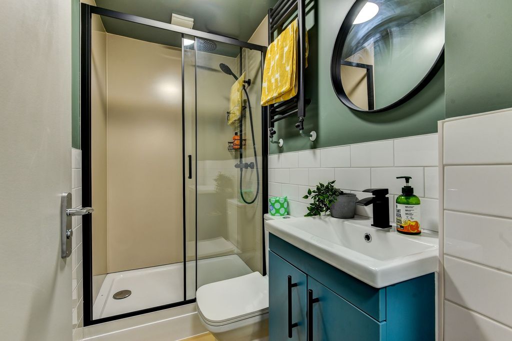 Property photo 2 of 6 This Modern Bathroom Features A Sleek Shower, Styl...