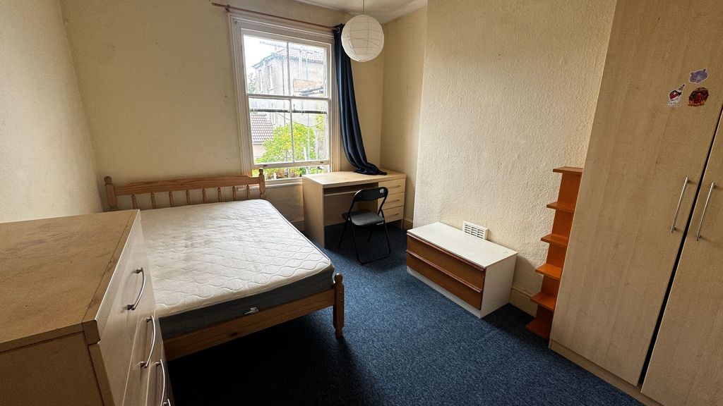 Property photo 3 of 15 Bright And Straightforward Bedroom With A Large Wi...