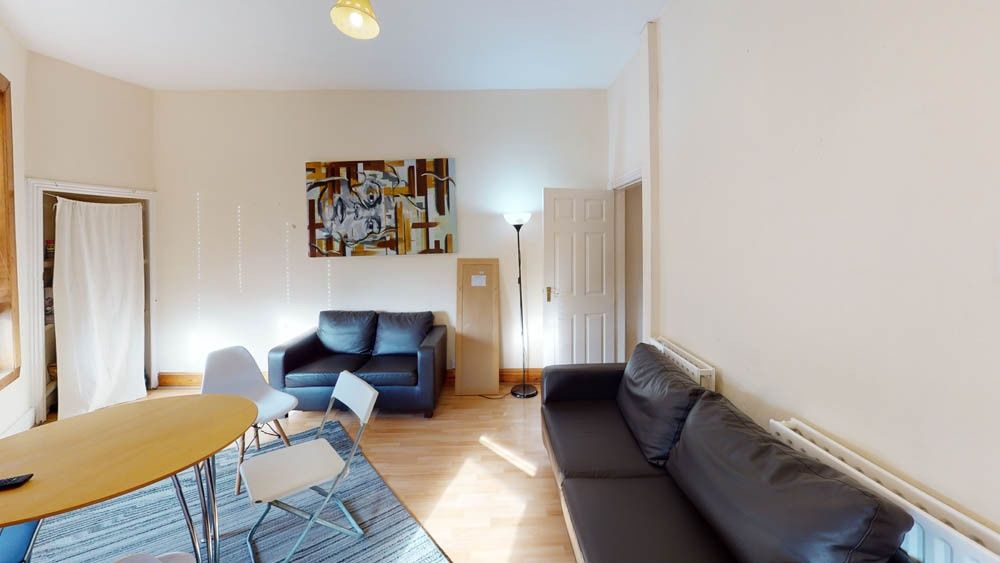 Property photo 1 of 21 A Bright And Welcoming Living Room Featuring Comfo...