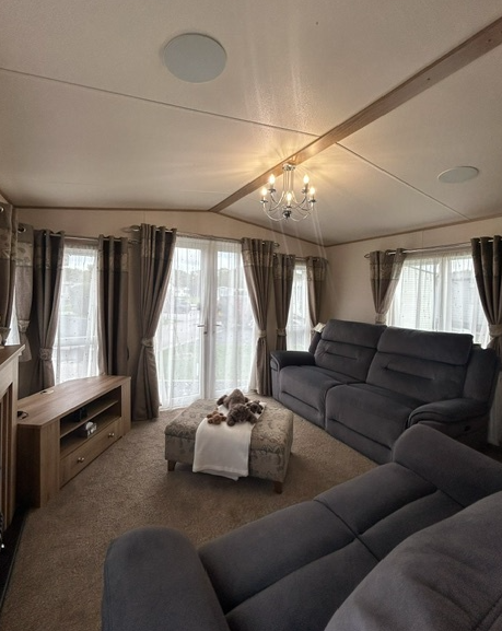 Property photo 3 of 7 Spacious Abi Ambleside Living Room With Comfortable Sofas, Neutral Decor And Patio Doors