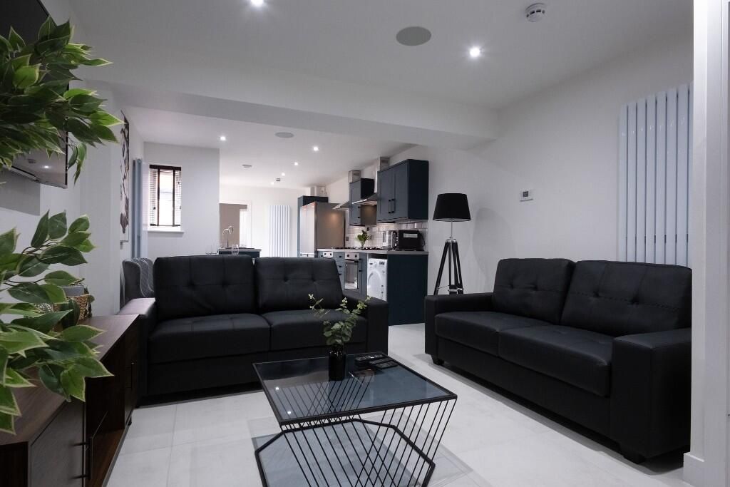 Property photo 1 of 13 A Stylish And Contemporary Living Room Featuring T...