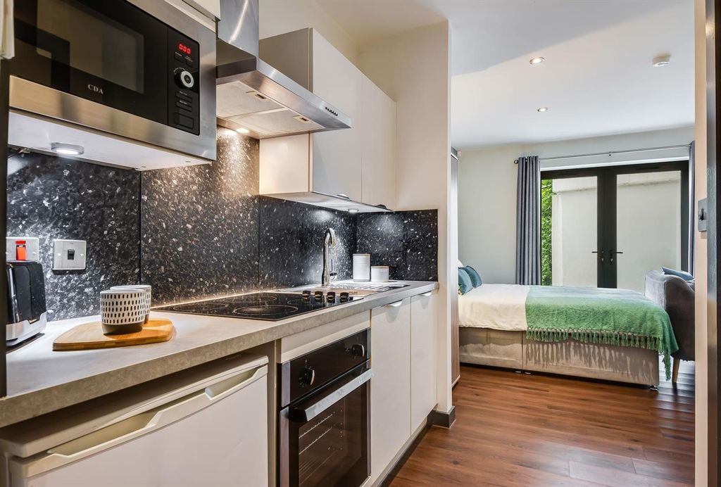 Property photo 3 of 6 Modern Sleek Kitchenette With High-End Finishes...