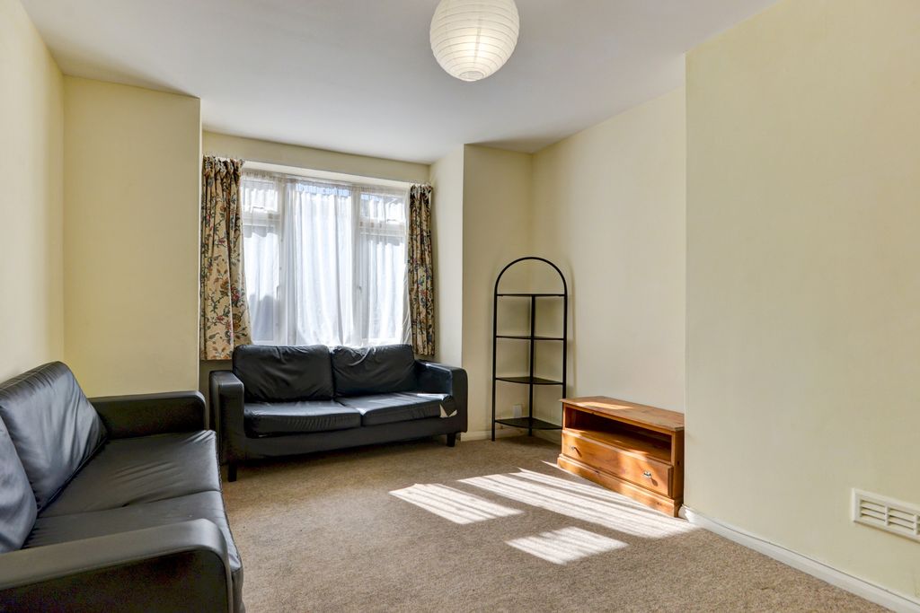 Property photo 3 of 21 A Bright And Inviting Living Room Featuring Large ...