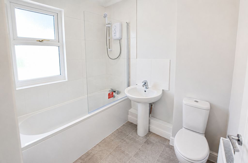 Property photo 3 of 8 Bright Modern Bathroom With A Full-Sized Tub...