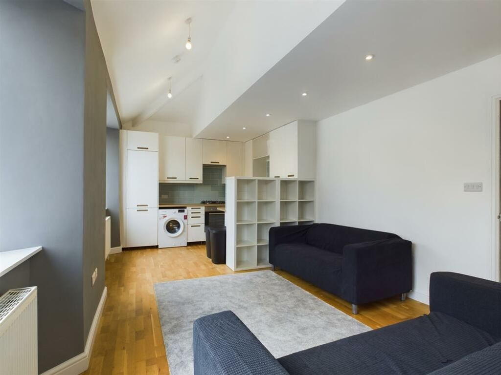 Property photo 1 of 18 A Spacious And Modern Living Room With Ample Natur...