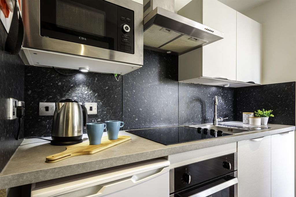 Property photo 3 of 4 Modern Kitchen With Sleek Built-In Appliances...