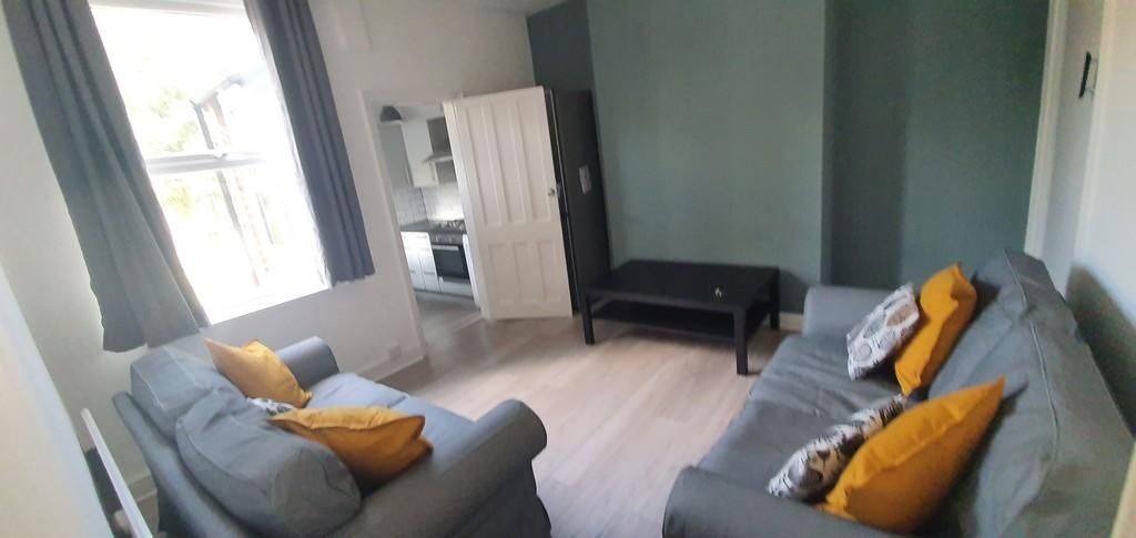 Property photo 2 of 8 A Bright And Welcoming Living Room Featuring Comfo...