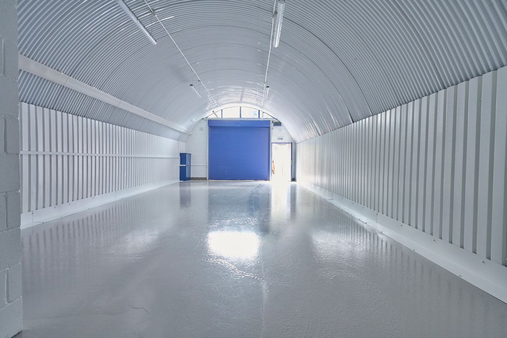 Property photo 3 of 8 An Empty Arch With White Lining, Facing The Front Electric Roller Shutter Entrance, Which Is Closed.