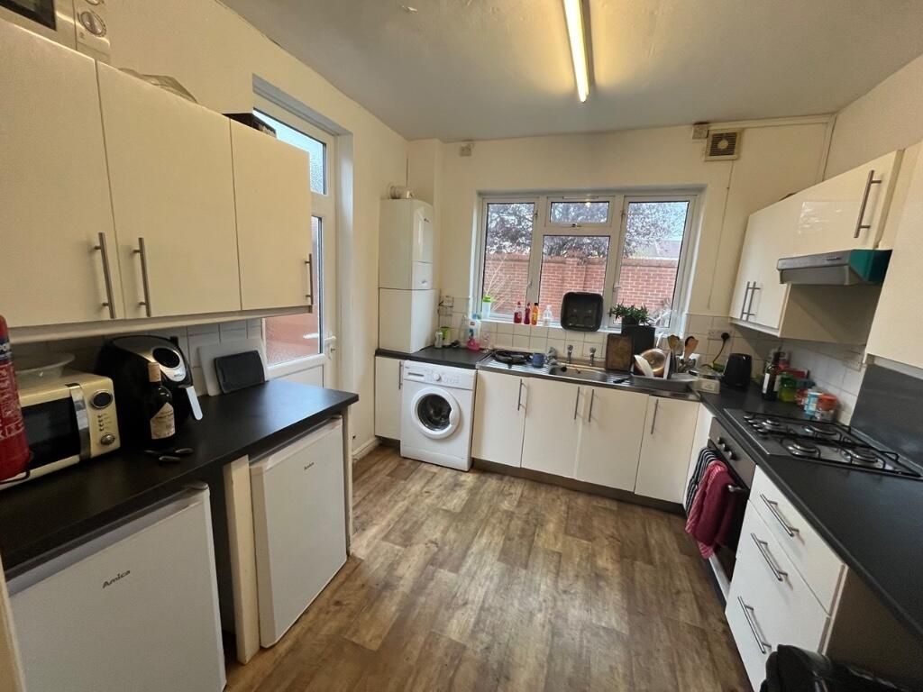 Property photo 1 of 15 Bright And Spacious Kitchen Featuring Ample Counte...