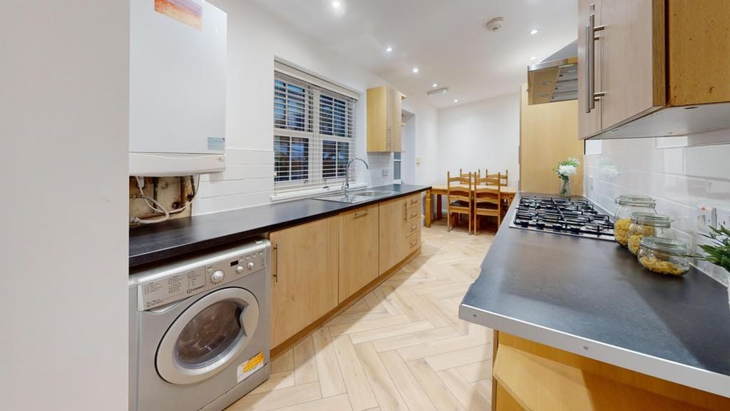 Property photo 1 of 22 A Spacious And Modern Kitchen Equipped With A Wash...