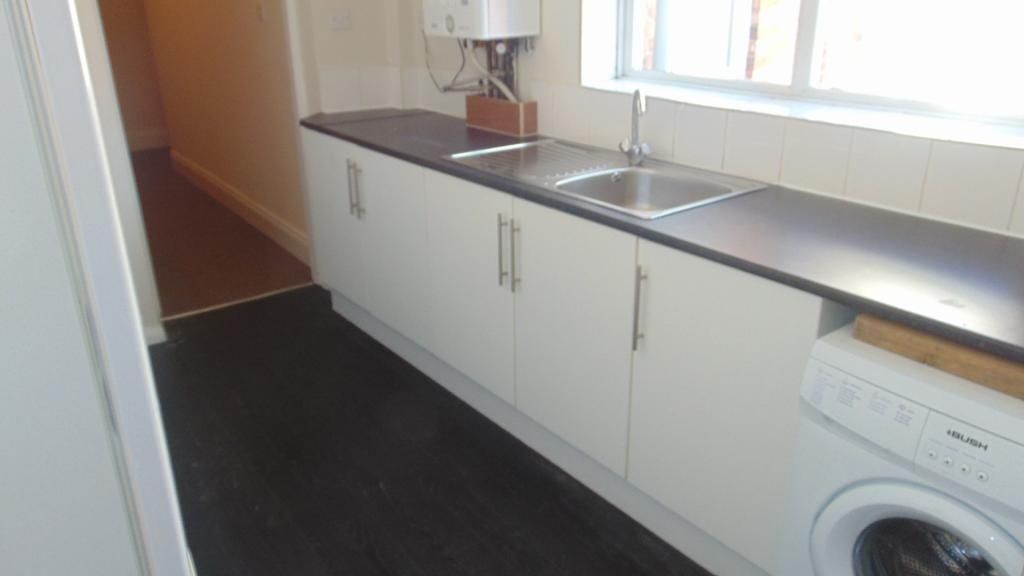 Property photo 3 of 8 Bright Kitchen With Ample Counter Space, White Cab...