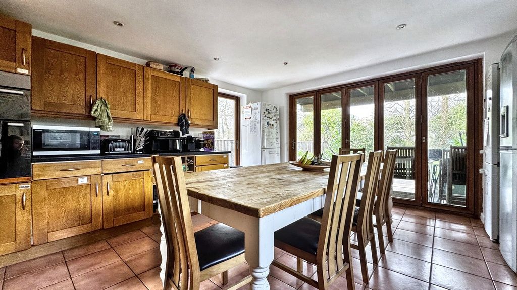 Property photo 3 of 15 Spacious, Well-Equipped Kitchen With Warm Wooden c...