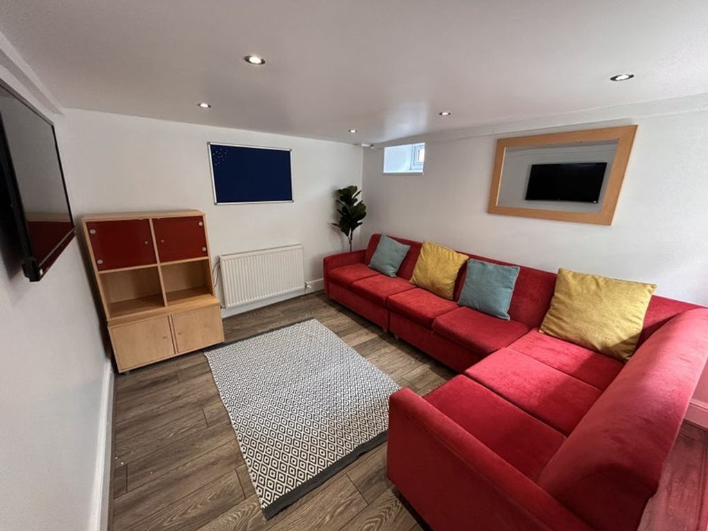 Property photo 2 of 9 This Inviting Living Room Features A Spacious Red ...