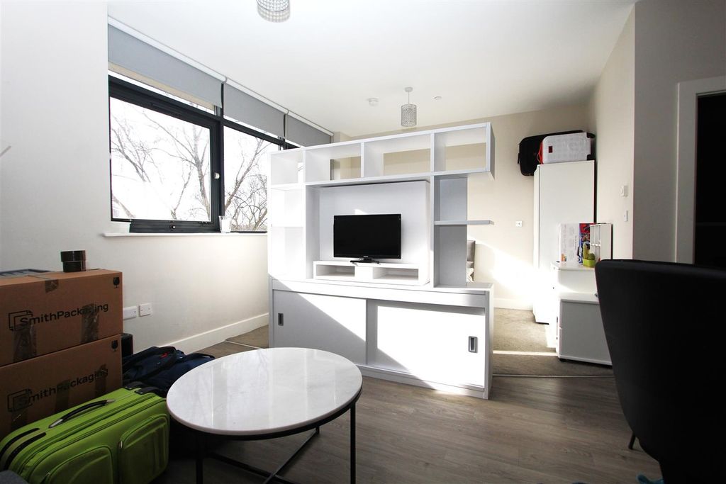 Property photo 1 of 8 Bright Lounge With Sleek Modern Shelving...
