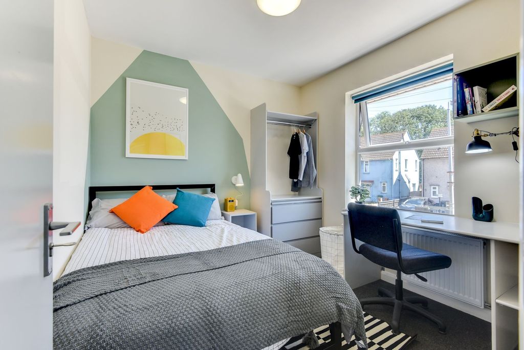 Property photo 3 of 5 A Cozy Double Bedroom Featuring Vibrant Decor With...