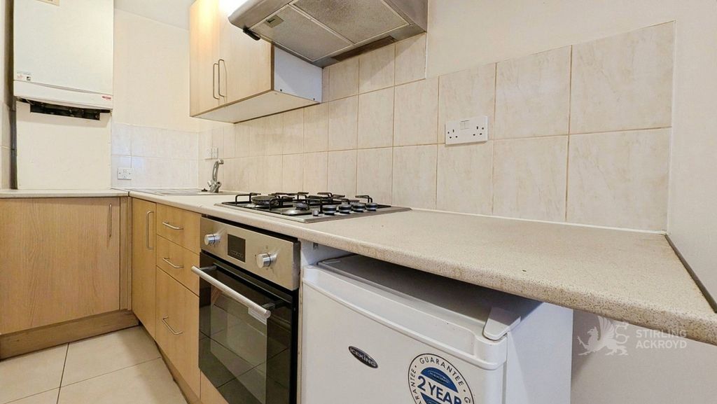 Property photo 2 of 6 Kitchen Area