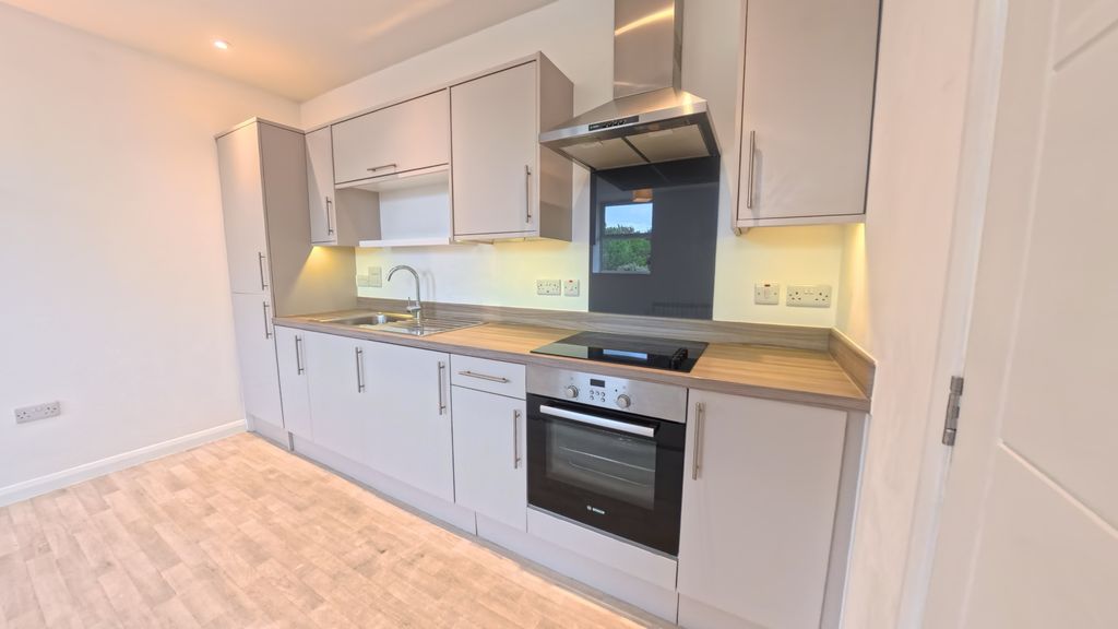 Property photo 3 of 7 Kitchen Area