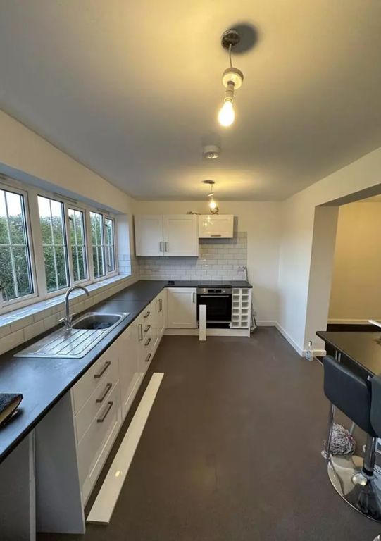 Property photo 3 of 10 A Modern And Spacious Kitchen With Ample Natural l...