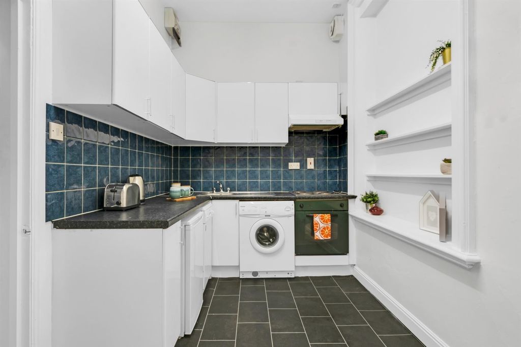 Property photo 2 of 5 Bright, Modern Kitchen With Clean White Cabinetry,...