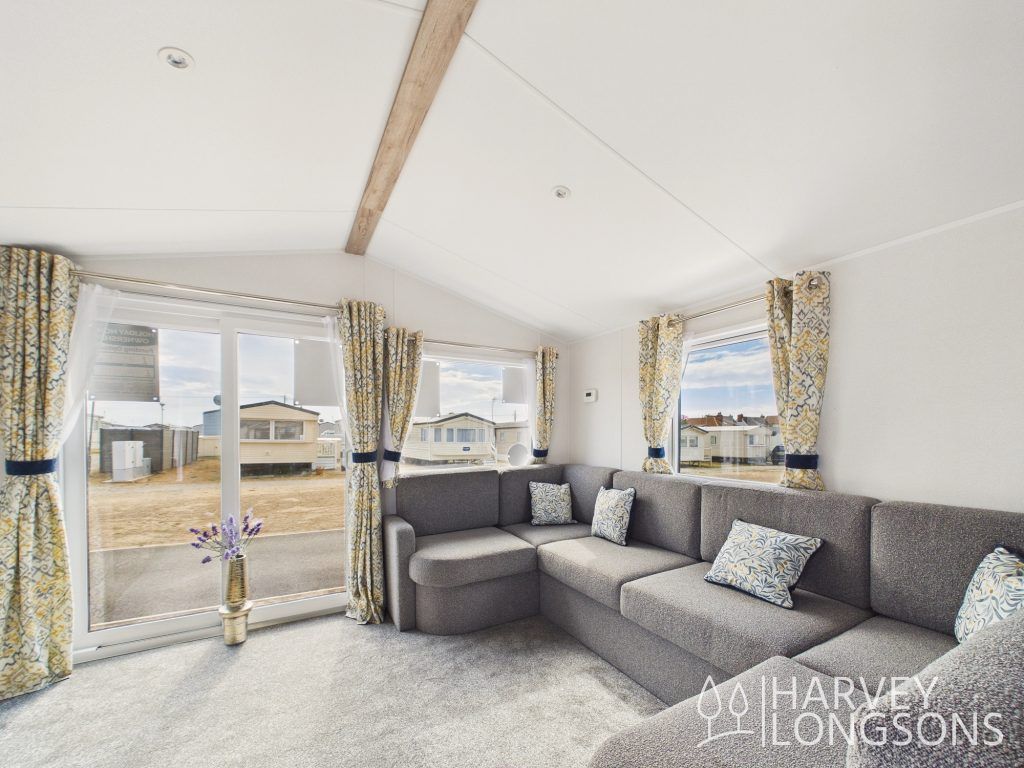 Property photo 2 of 13 Bright Lounge With Corner Sofa And Large Patio Doors.