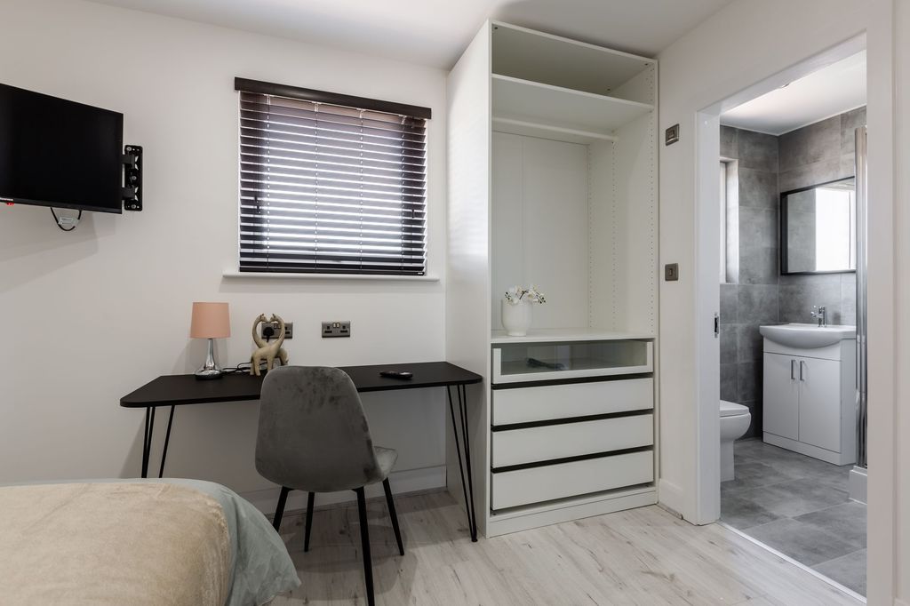 Property photo 1 of 5 Bright And Modern Bathroom With Gray Tiled Walls, ...