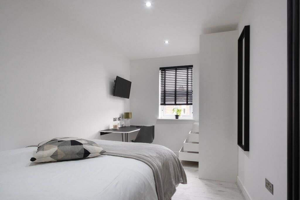 Property photo 1 of 14 Bright And Modern Master Bedroom Featuring A Comfo...