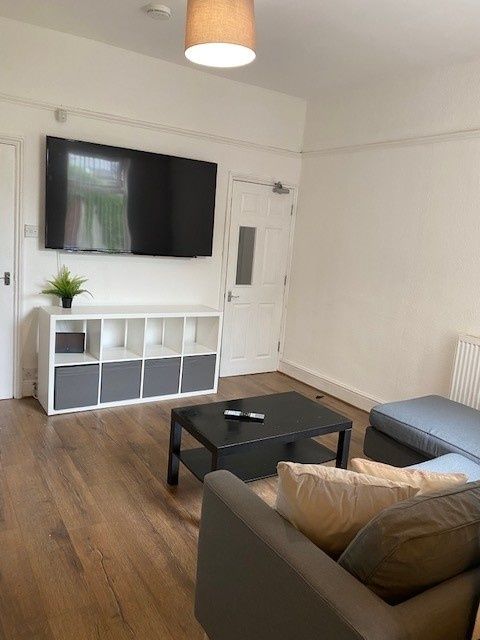 Property photo 1 of 15 Spacious Living Room Featuring Modern Furnishings,...