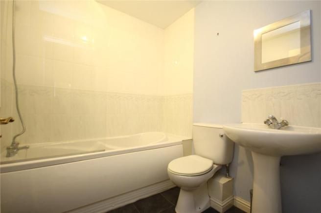 Property photo 3 of 9 Well-Maintained Bathroom With A Full-Size Bathtub ...