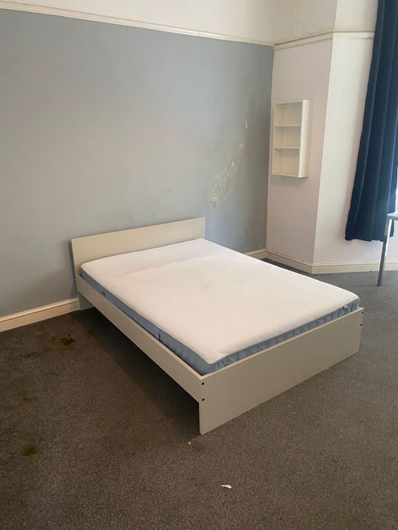 Property photo 2 of 8 A Plain Bedroom Featuring A Single Bed Frame With ...