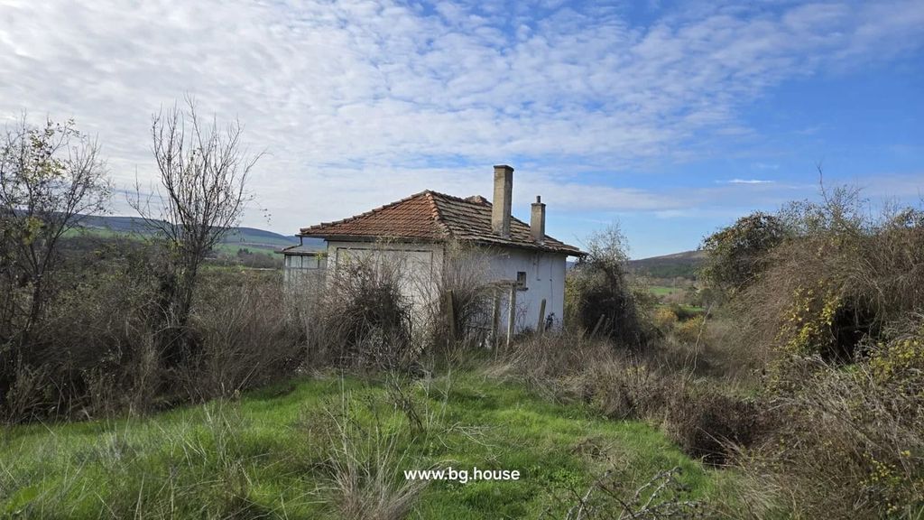 Property photo 1 of 48 View Of A Small White House With A Tiled Roof And Chimney, Surrounded By Wild Grass And Bushes