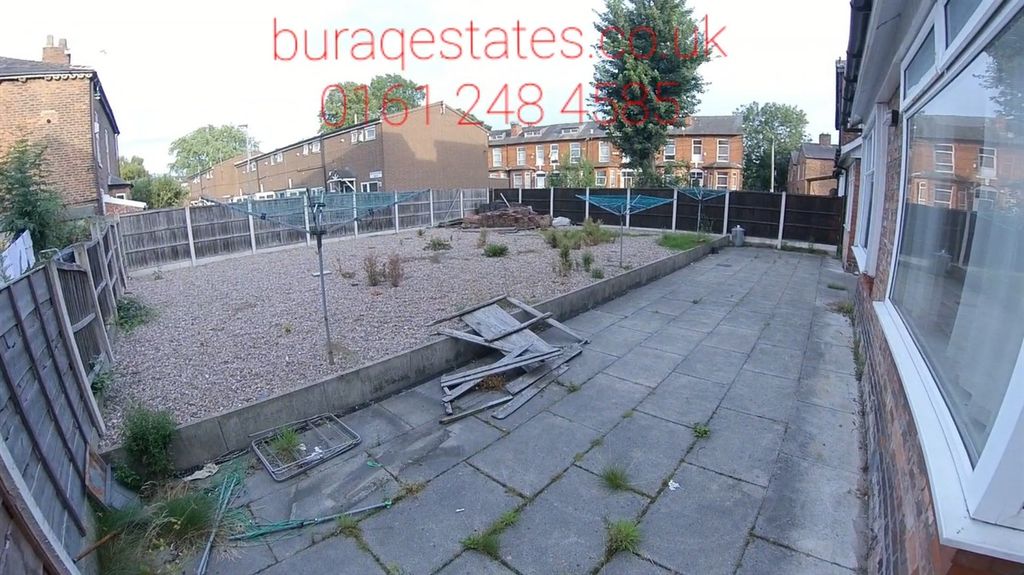 Property photo 1 of 15 A Spacious, Sunlit Garden Area Featuring A Paved P...