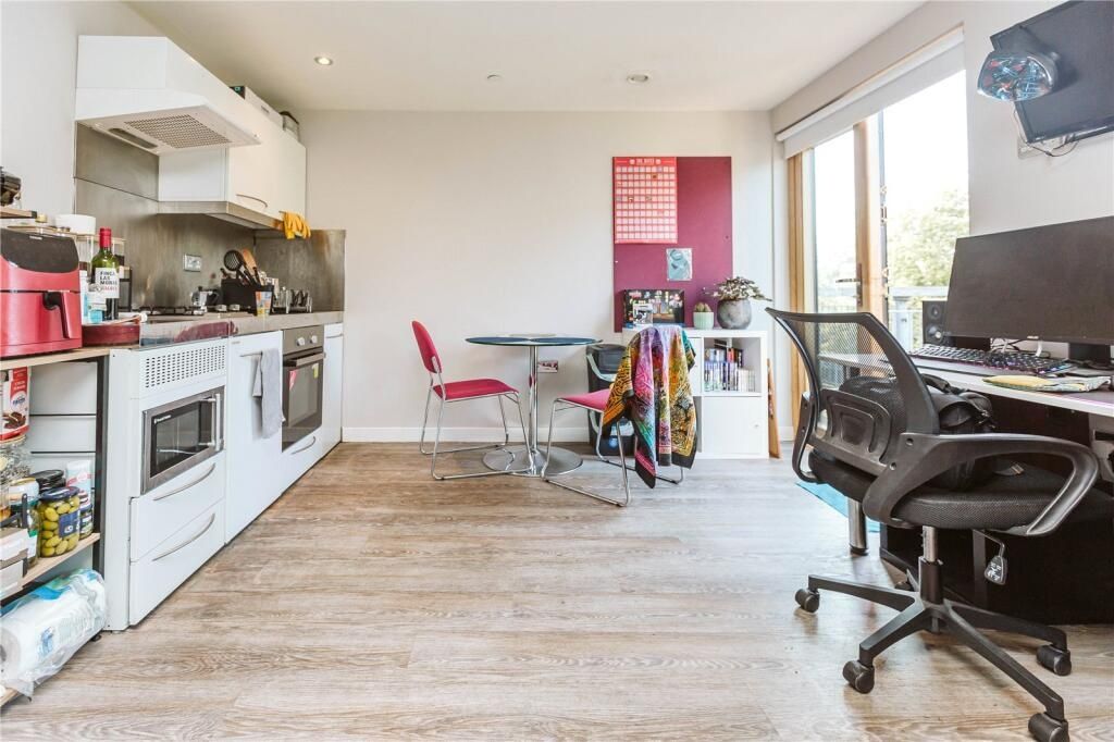 Property photo 2 of 6 Bright And Modern Kitchen Area Featuring Ample Nat...