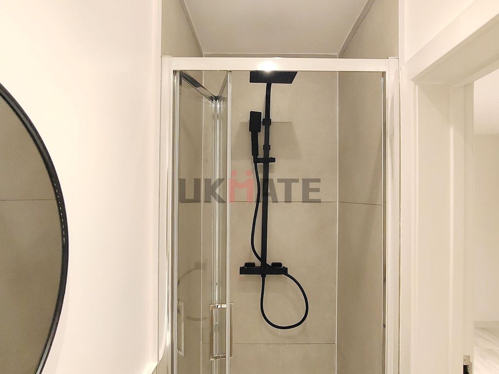 Property photo 3 of 10 A Clean And Modern Bathroom Featuring A Sleek Show...