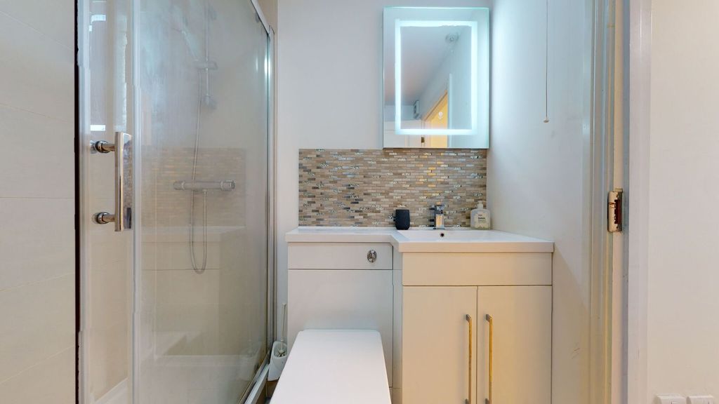Property photo 1 of 13 Modern Bathroom Featuring A Glass-Enclosed Shower ...
