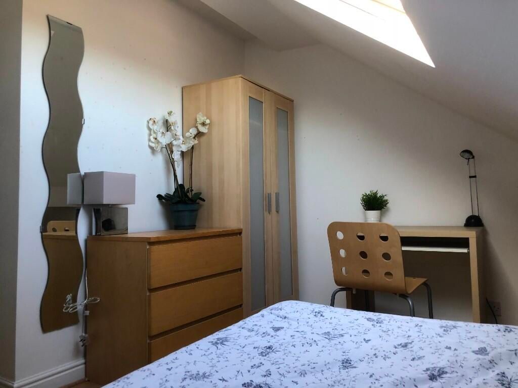 Property photo 1 of 12 Bright And Modern Master Bedroom Featuring A Comfo...