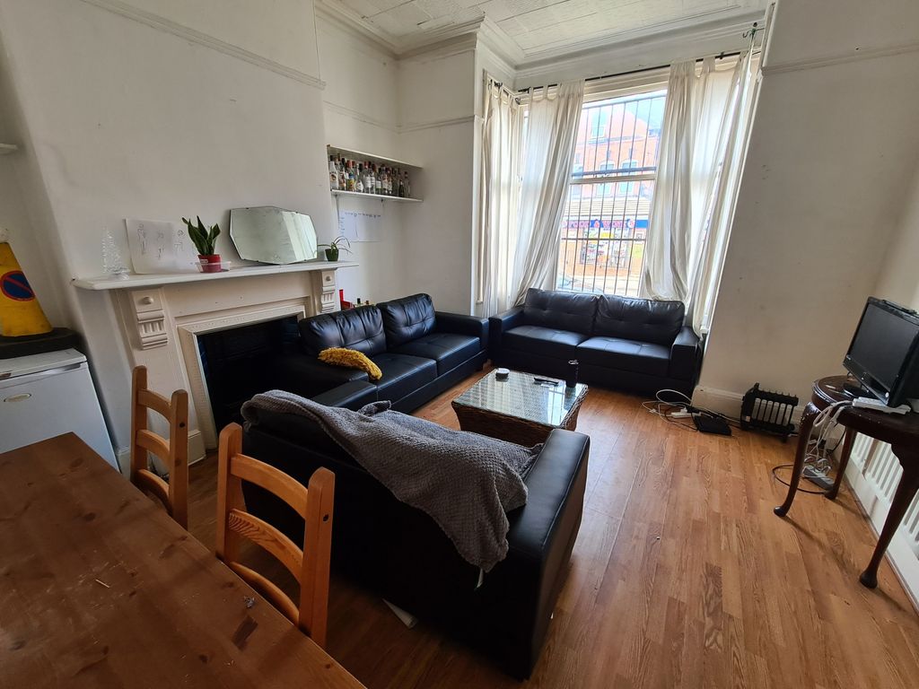 Property photo 2 of 28 Bright And Welcoming Living Room Featuring Comfort...