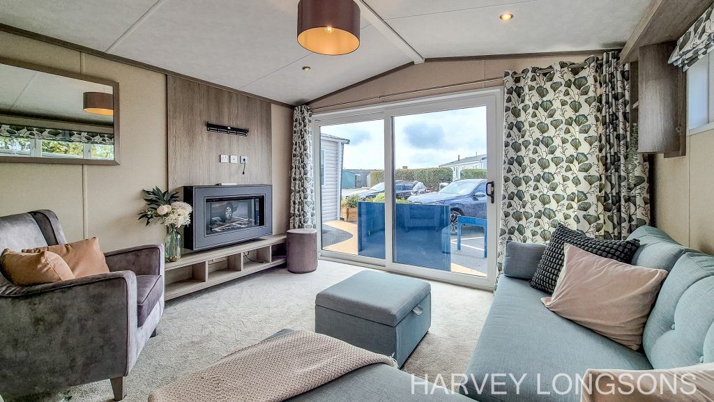 Property photo 3 of 21 Spacious Lounge With Patio Doors And Electric Fire.