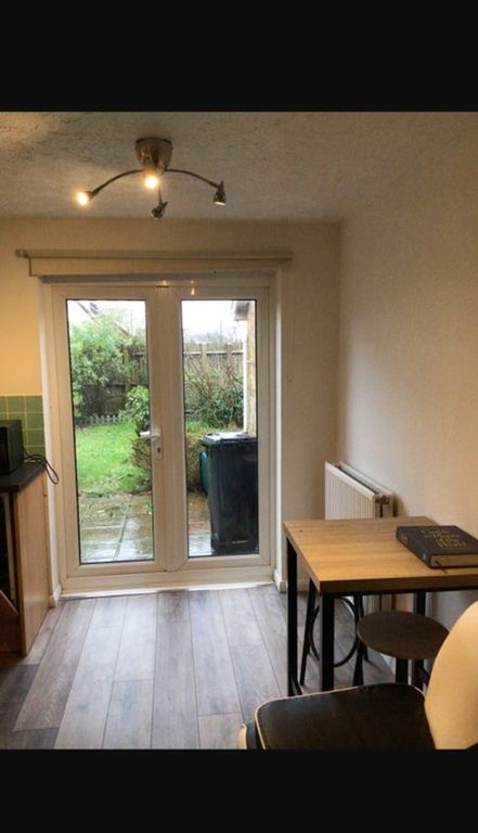 Property photo 2 of 9 A Cozy Kitchen Space Featuring A Small Dining Area...