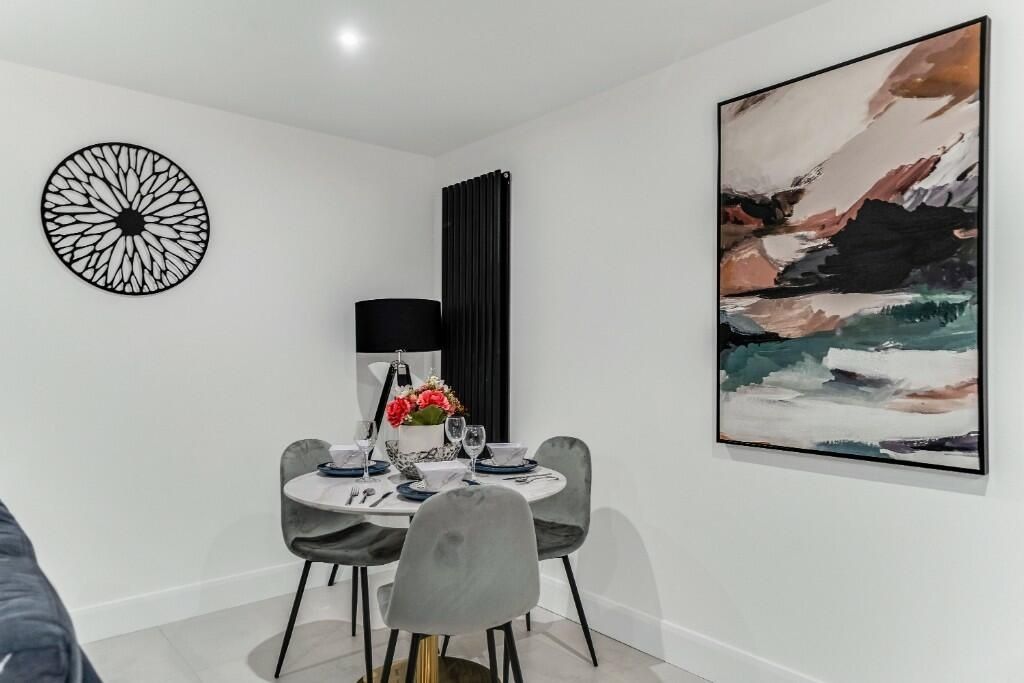 Property photo 1 of 14 A Modern And Cozy Living Room Featuring A Stylish ...