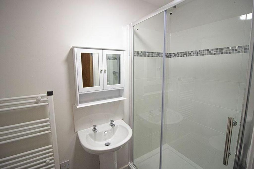 Property photo 3 of 5 A Modern Bathroom Featuring A Stylish Shower Enclo...