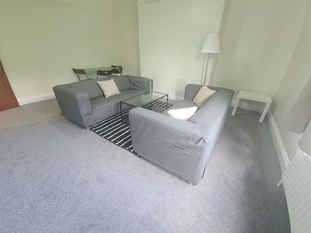 Property photo 3 of 9 A Bright And Inviting Living Room Featuring Comfor...